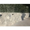 Fieldstones Gneiss Grey applied on exterior fence wall with clean joint lines and modern grey tone.