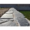 Fieldstones Gneiss Blue Green applied on low wall in modern garden design with natural surface texture.