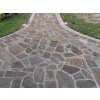 Flagstone paving Gneiss Brown path leading to house entrance with rustic natural appearance.