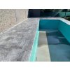 Pool edge finished with grey marble coping — Marble Lagune, tumbled 80×25×3 cm non-slip natural stone.