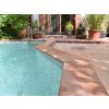 Pool surround finished with non-slip natural-stone coping - Sandstone Modak 100×25×3 cm.