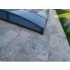 Paving slabs Travertine Silver showing natural texture and color variation on poolside steps.