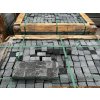 Crated Granite Black setts 10×10×8 cm — sawn sides with split faces, ready for street and plaza paving.