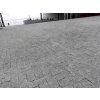 Large forecourt paved in Granite Grey cobbles 10×10×8 cm — heavy-duty natural-stone surface.