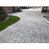 Curved walkway with Grigio Black granite pavers 20×10×3 cm — sawn edges, flamed slip-resistant finish.