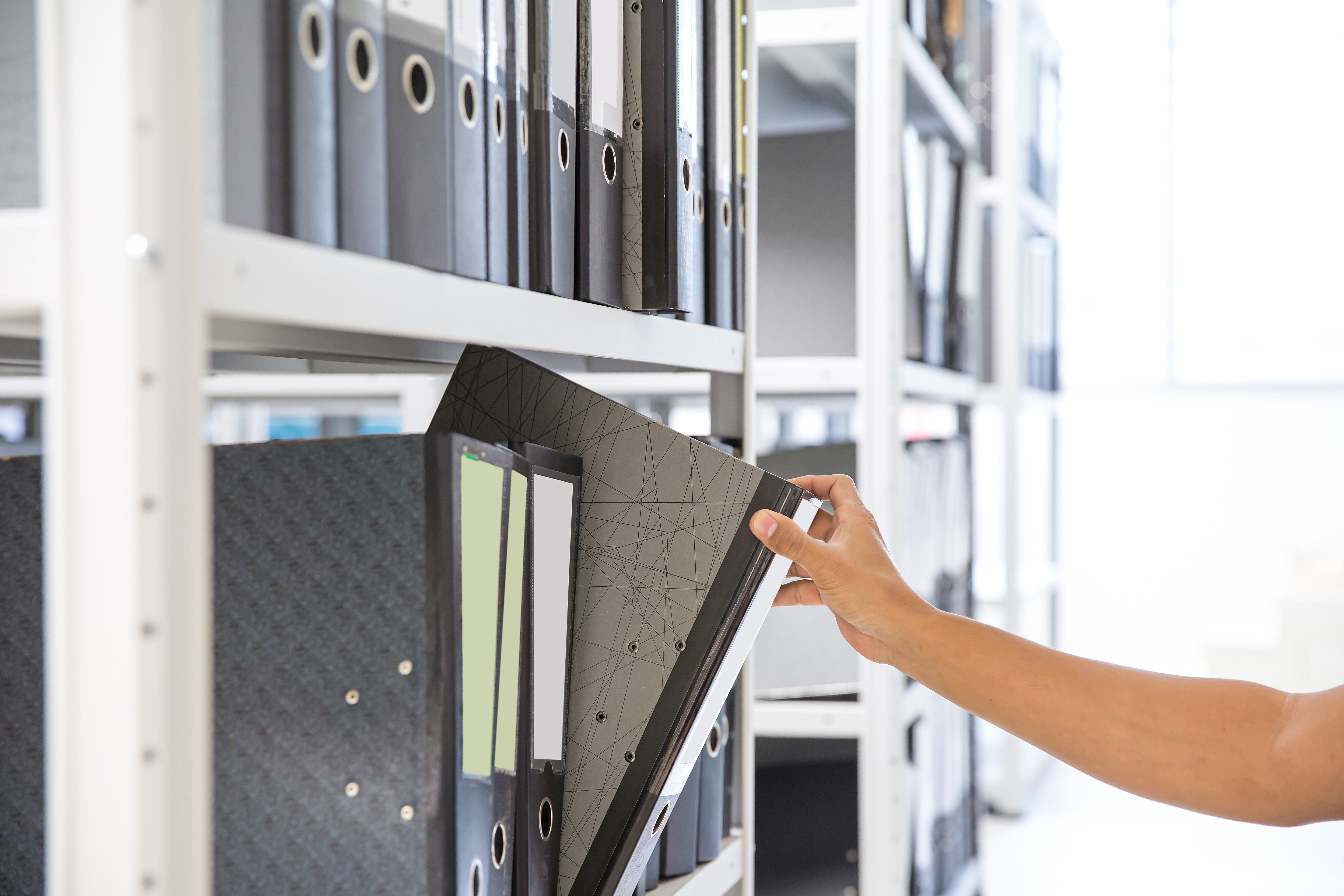 hand-choose-files-folder-archive-shelf