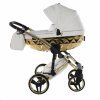 Sophisticated side profile of Junama Enzo Golden stroller in golden tone