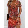 Dámské letní šaty s výrazným oranžovým boho vzorem a výstřihem do V