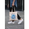 cropped face mockup of a man holding a tote bag in the street 29424