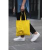 cropped face mockup of a man holding a tote bag in the street 29424 (2)