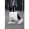 cropped face mockup of a man holding a tote bag in the street 29424 (2)