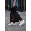 cropped face mockup of a man holding a tote bag in the street 29424 (3)