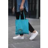 cropped face mockup of a man holding a tote bag in the street 29424 (1)