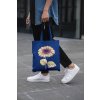 cropped face mockup of a man holding a tote bag in the street 29424