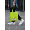 cropped face mockup of a man holding a tote bag in the street 29424 (2)