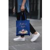 cropped face mockup of a man holding a tote bag in the street 29424