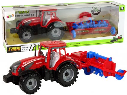 Červený traktor s třecím pohonem pluhu