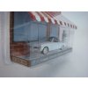 Studebaker Comander Starliner 1954 + stojan 1:64 Hobby Shop série 16 Greenlight