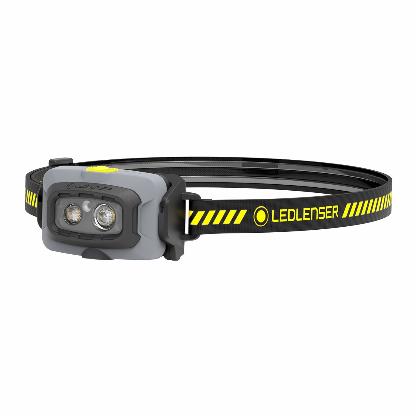 Ledlenser HF4R Work žltá — čelovka šikmo spredu, sivá hlava so žltým tlačidlom a dvoma LED, čierno-žltý popruh s pruhmi