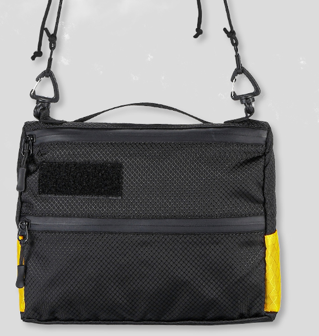 Nitecore CLOUD SLB04 sling taška spredu, čierny 400D nylon so žltými rohmi, horné pútko a odnímateľný šnúrkový popruh s karabínami
