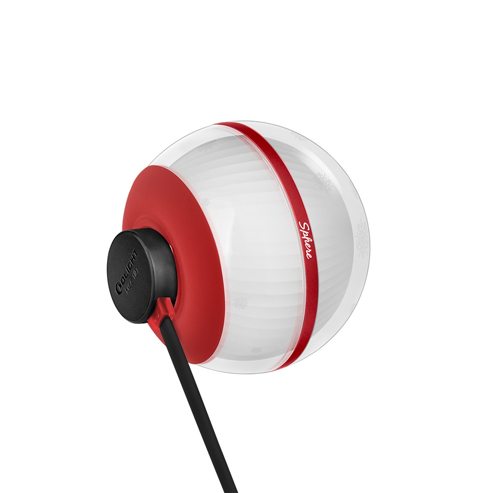 Olight Sphere Snowflake nabíjanie – magnetický konektor kábla MCC 1A prichytený na červenom spodku gule