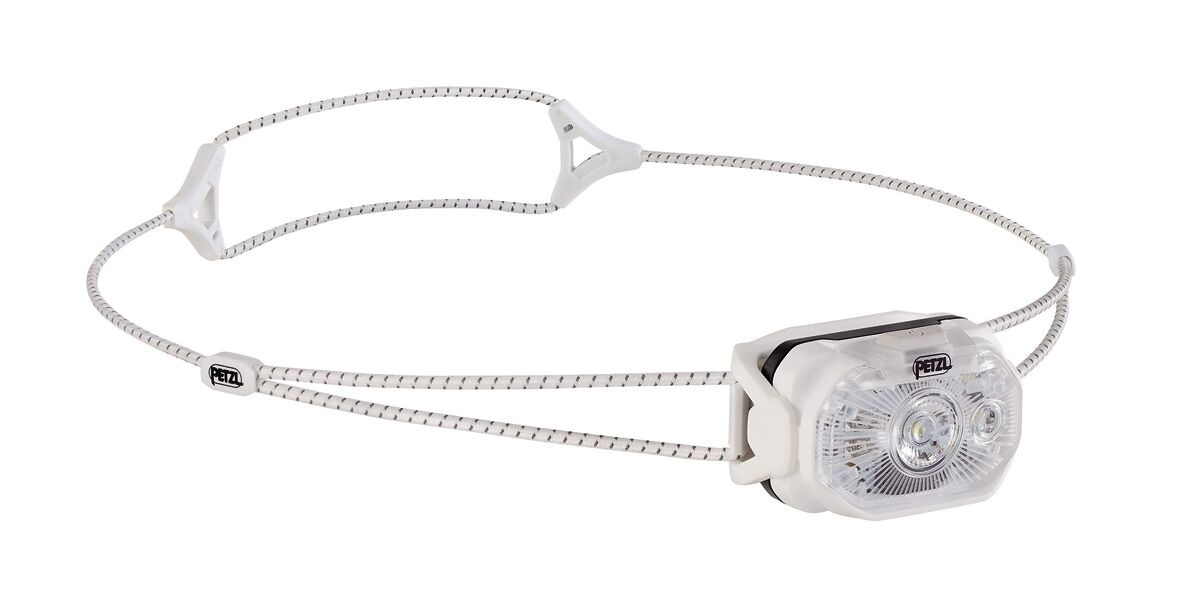 Petzl SWIFT LT v bielej — kompletná čelovka s bielym telom, priehľadnou optikou s dvoma LED a svetlým hlavovým pásikom z dvoch elastických šnúr s reflexným vláknom