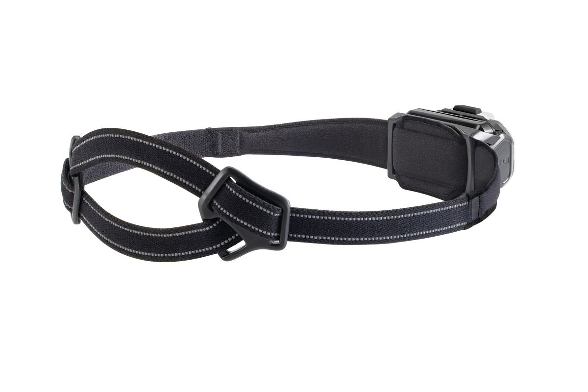 Petzl — samotný široký čierny hlavový pásik CLASSIC s deleným strihom, svetlým reflexným prešitím a dvoma plastovými prackami, vpravo telo čelovky SWIFT RL