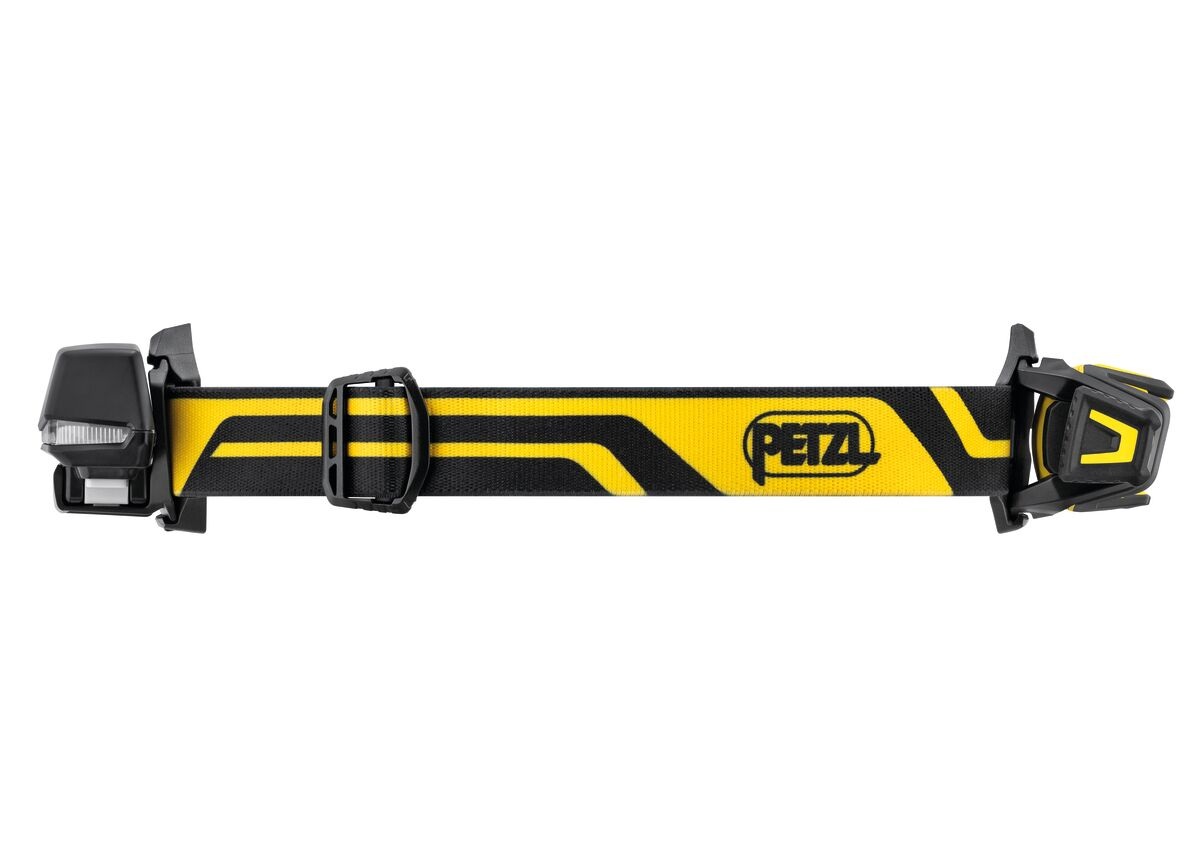 Petzl XENA — pohľad zhora na rozložený hlavový pásik s prednou lampou vpravo a zadným akumulátorom vľavo