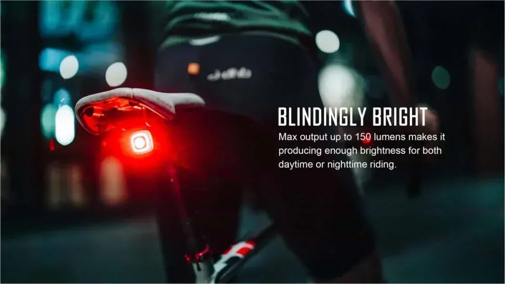 Magicshine SEEMEE 150 zadné svetlo pod sedlom bicykla v nočnom meste svieti načerveno, infografika Blindingly Bright