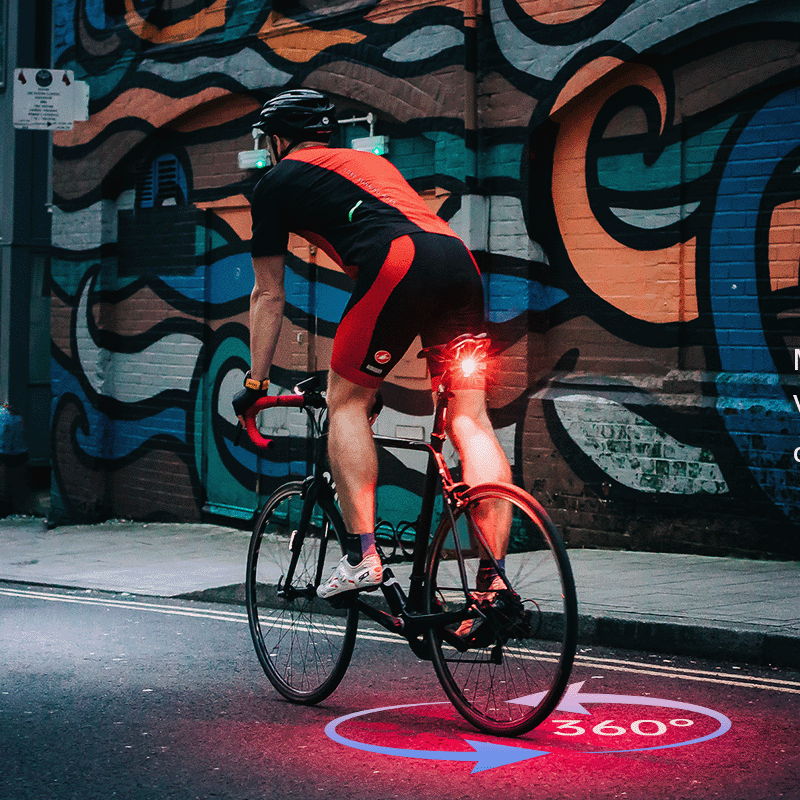 Animácia výrobcu Magicshine: zadné svetlo SEEMEE 200 V3.0 kreslí červený kruh 360 stupňov na asfalt okolo bicykla