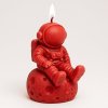 červený astonaut svíčka