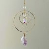 Lapač slunce - Galaktické kruhy  s ametystem, symbolem slunce, zlatý, 3 pohyblivé kruhy, délka 38,5 cm