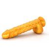 Zlaté dildo Luskoun položené na boku