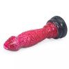 Červené dildo Červotoč s černou přísavkou položené na boku
