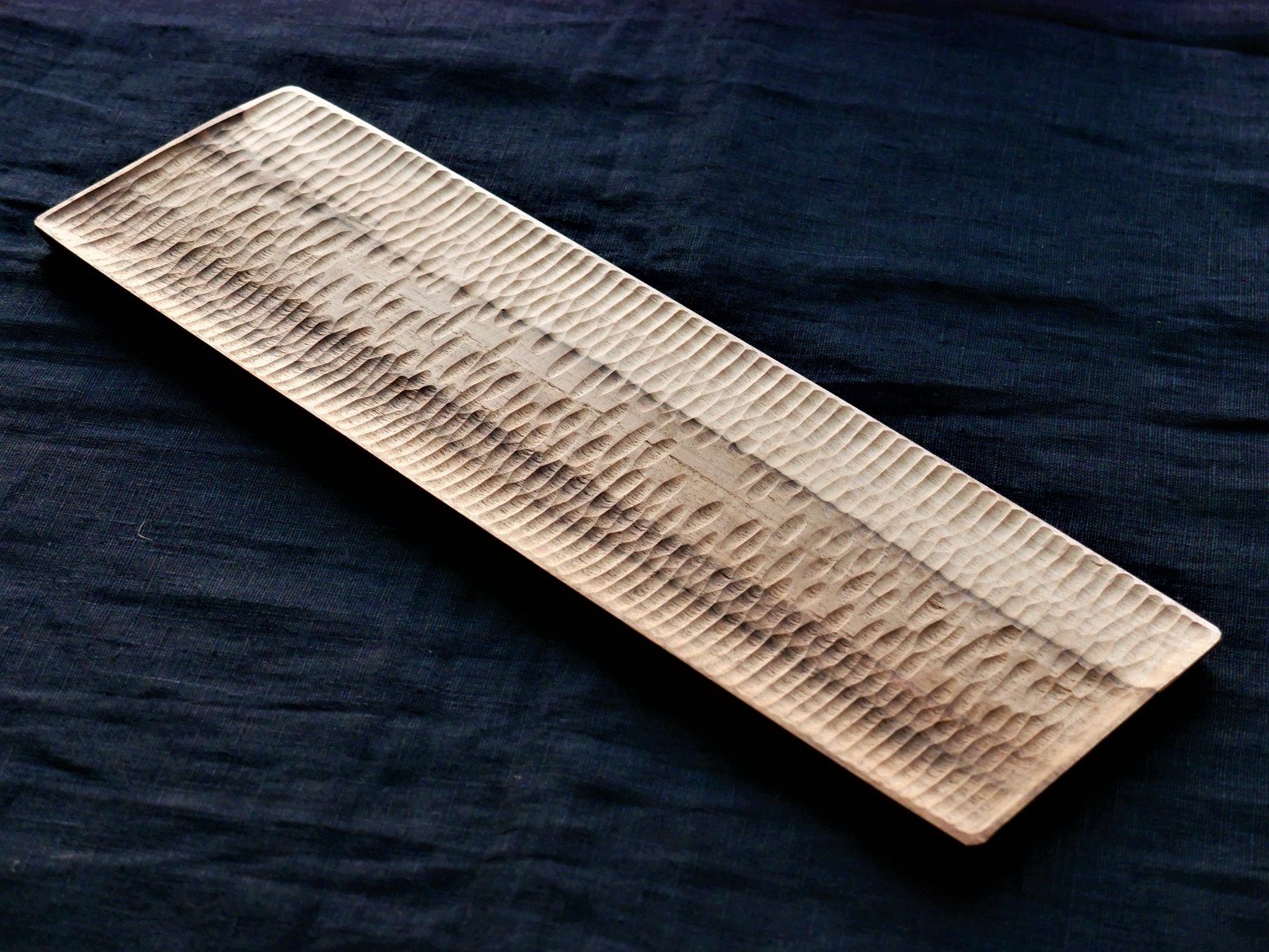 Hand carved tea trays from natural or ebonized wood inspired by