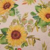 Elegantní režná látka s motivem slunečnic a listů,
