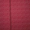 Bavlněná látka s folklorním vzorem drobných bílých kvítků na červeném podkladu