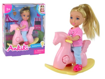 Baby doll for children on a rocking chair, pink rocking horse