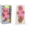 Baby doll in pink clothes, hat, pacifier, and blanket