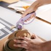c1a08edc1237bee1b235f8595c303d92 1066464 designer explore rotary cutter ultra lilac in use 01 1x1