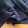 Navy pružný splývavý kepr, oblekovka polyester s elastanem
