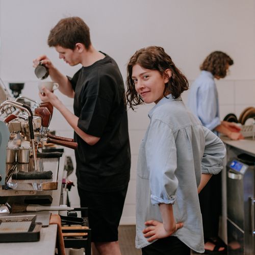 Barista behind the bar Barista behind the bar