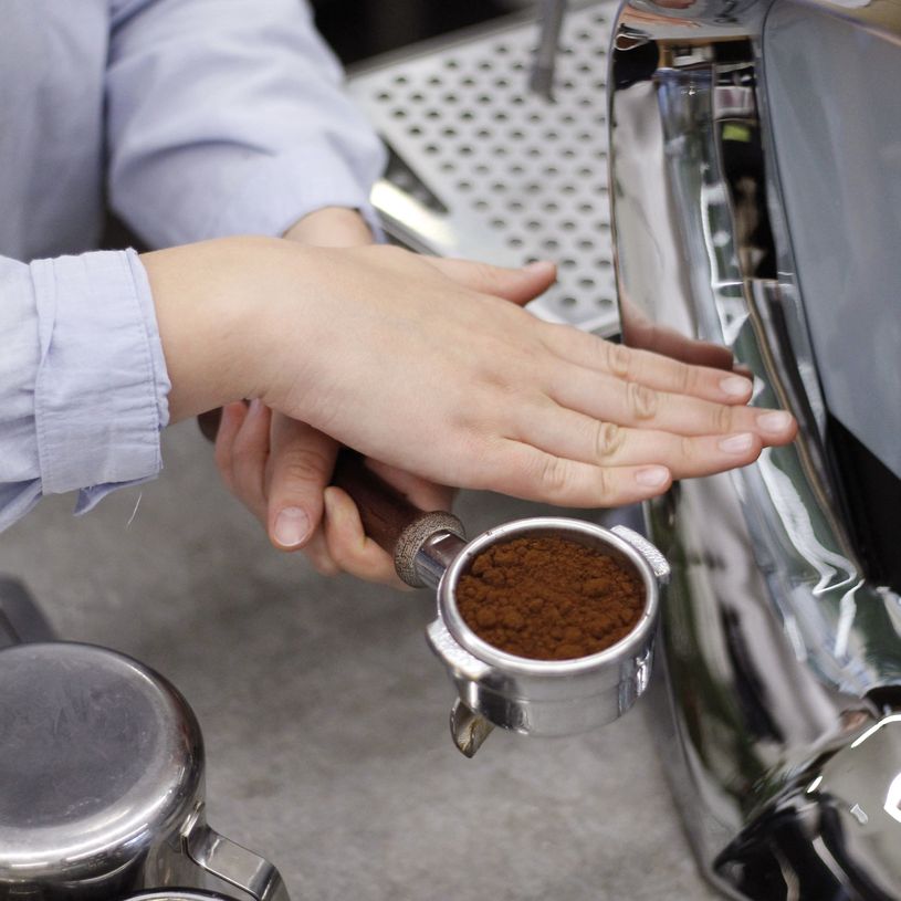 Ground coffee in a portafilter Ground coffee in a portafilter