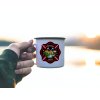 Enamel mug in the hand of a man outdoors 5