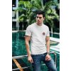 t shirt mockup of a fashionable man posing by a pool 430 el