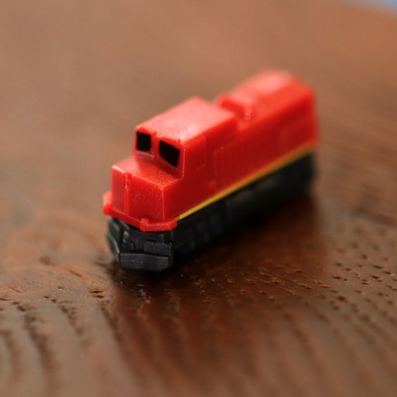 Little Plastic Train Company Miniatury vláčků Barva: The Sunset (červená) (Deluxe Board Game Train Set)