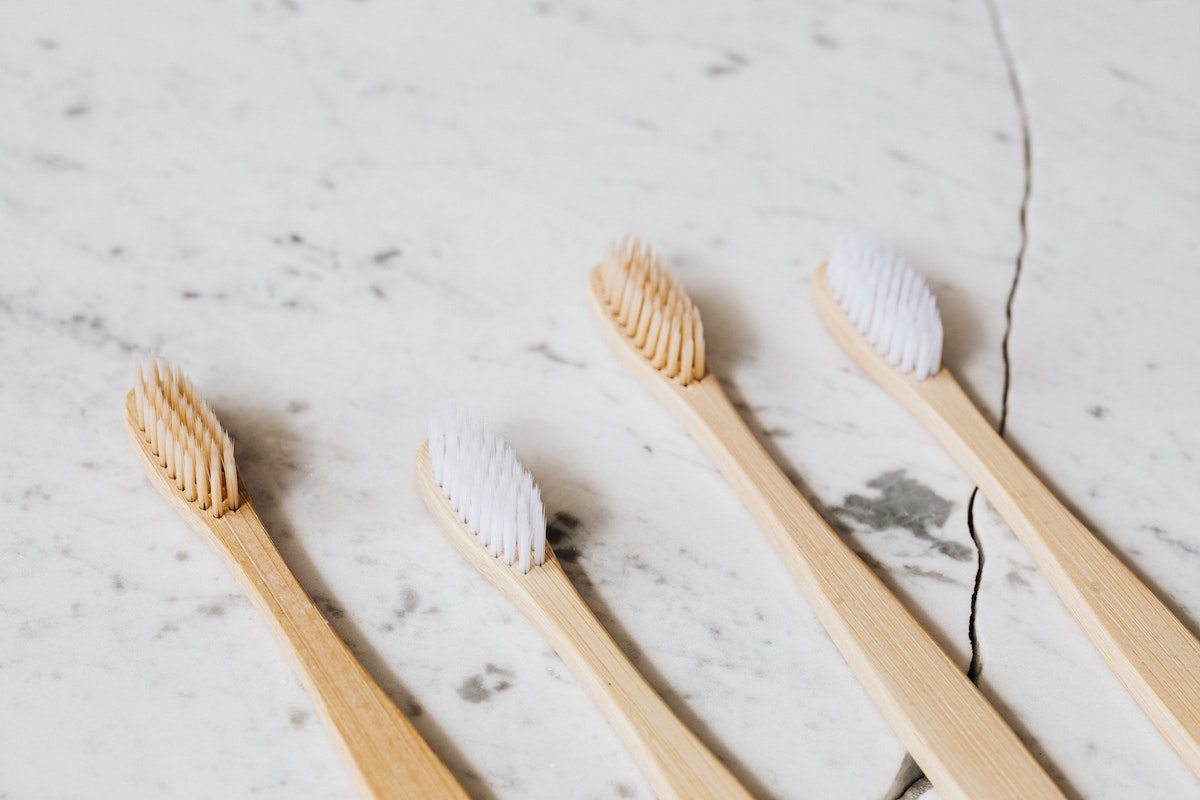 photo-of-four-toothbrush-on-white-surface-4202464