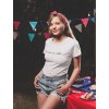 smiling girl wearing a tshirt mockup at a 4th of july bbq party va20827