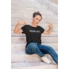 mockup of a woman pointing at her t shirt while posing by the stairs m16281 r el2