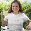 mockup of a happy middle aged woman wearing a t shirt while having a coffee in the backyard a16192